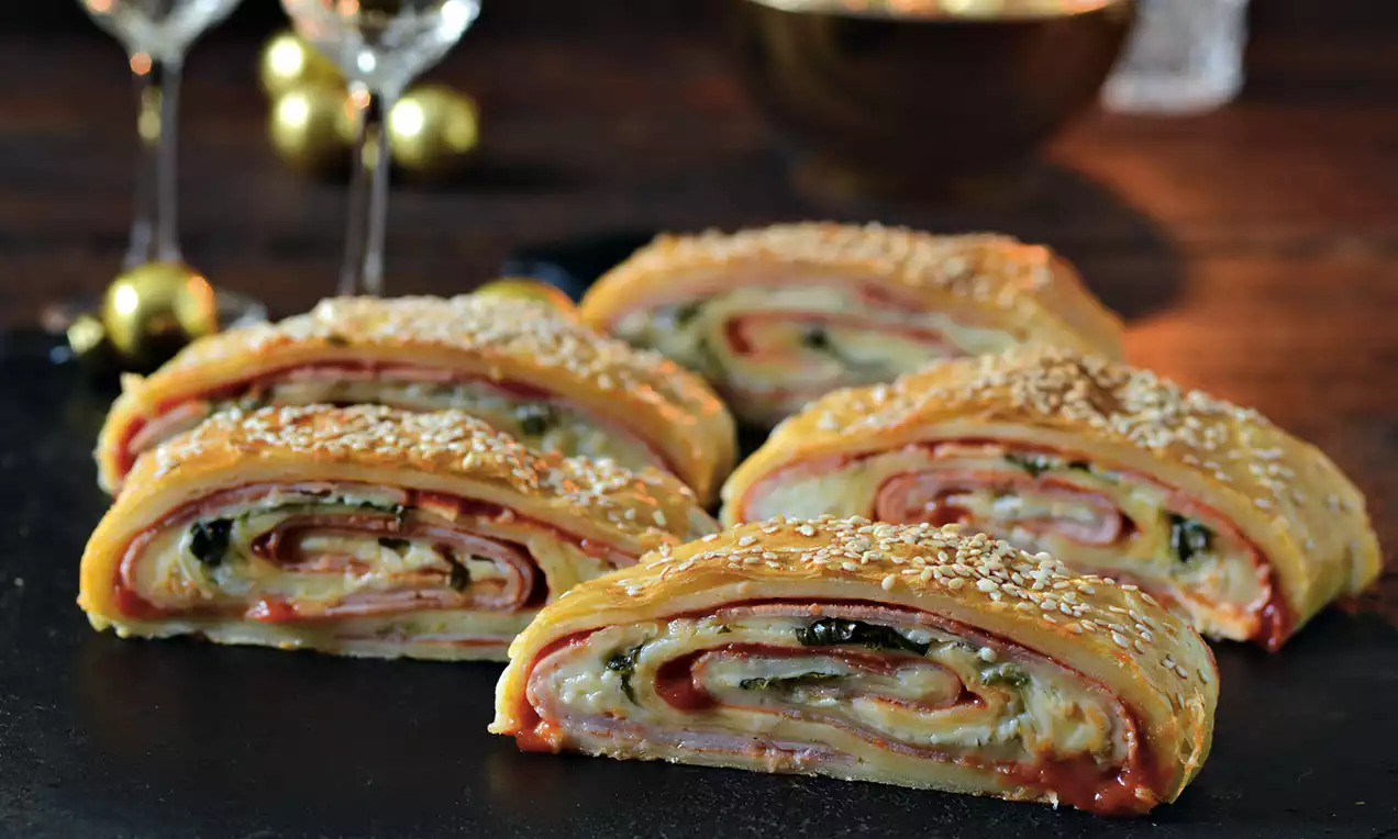 Salty rolls made from dough with ham and cheese filling.