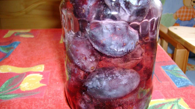 Preserved plums in jar