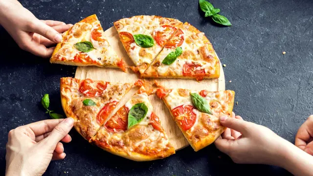Pizza slices being served