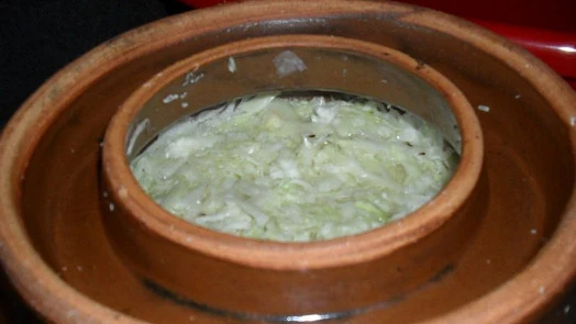 Fermented cabbage in clay pot